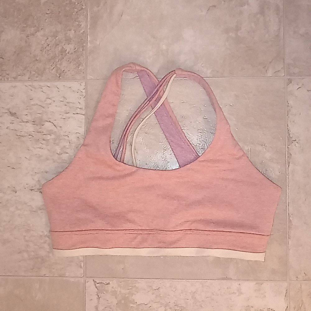 Heathered pink purple and white sports bra